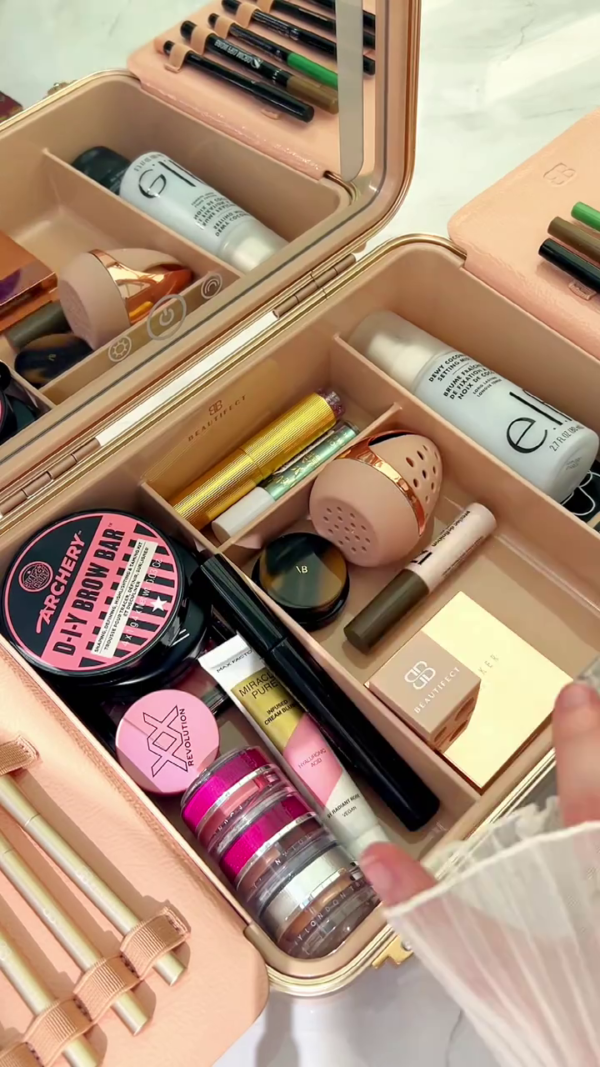 Luxury Portable Makeup Organizer with Built-In LED Mirror Featuring a Curated Collection of Premium Face, Eye, and Brow Products – Including Setting Sprays, Brow Kits, Highlighters, Powders, Cream Bases, Brushes, and Multi-Layer Stackable Pigments for Flawless On-the-Go Glam