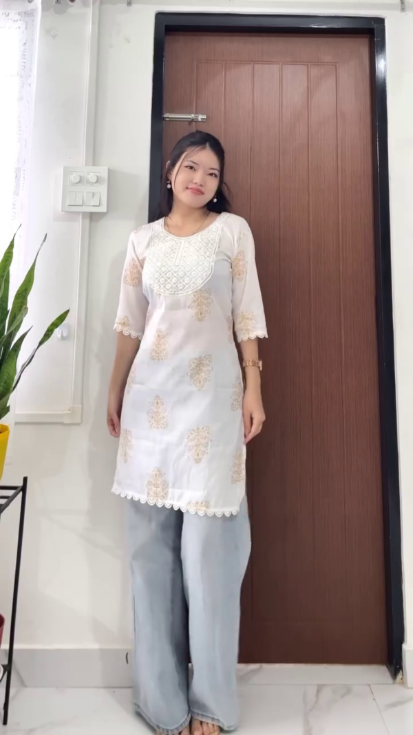 Stylish Cotton Kurtis with Front Detailing and Tassel Hem In multi Patterns Paired with Comfortable Wide-Leg Light Blue Denim Jeans – Casual Ethnic Fusion Wear for Women