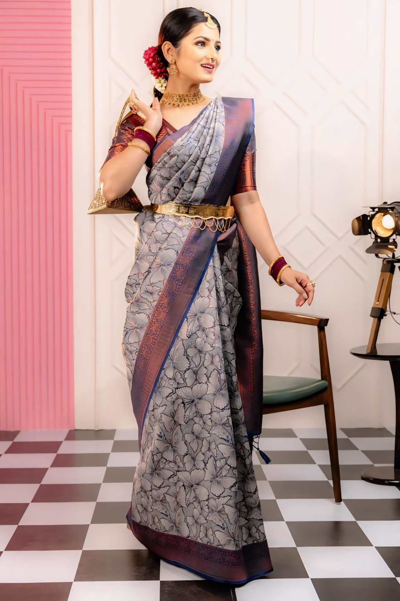 THE SAREE SHOWCASES A DELICATE INTERPLAY OF COLORS AND PATTERNS